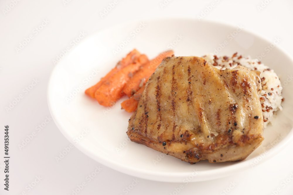 Grilled chicken with rice isolated in white background