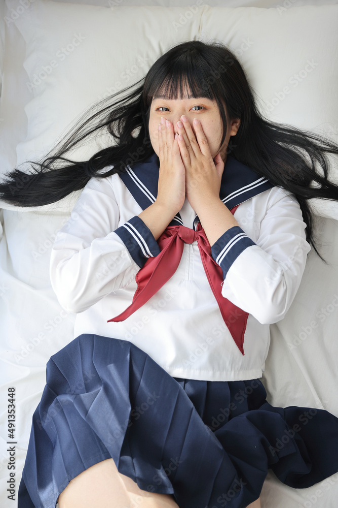 Asian High School Girls student smile while sleeping in white room ...