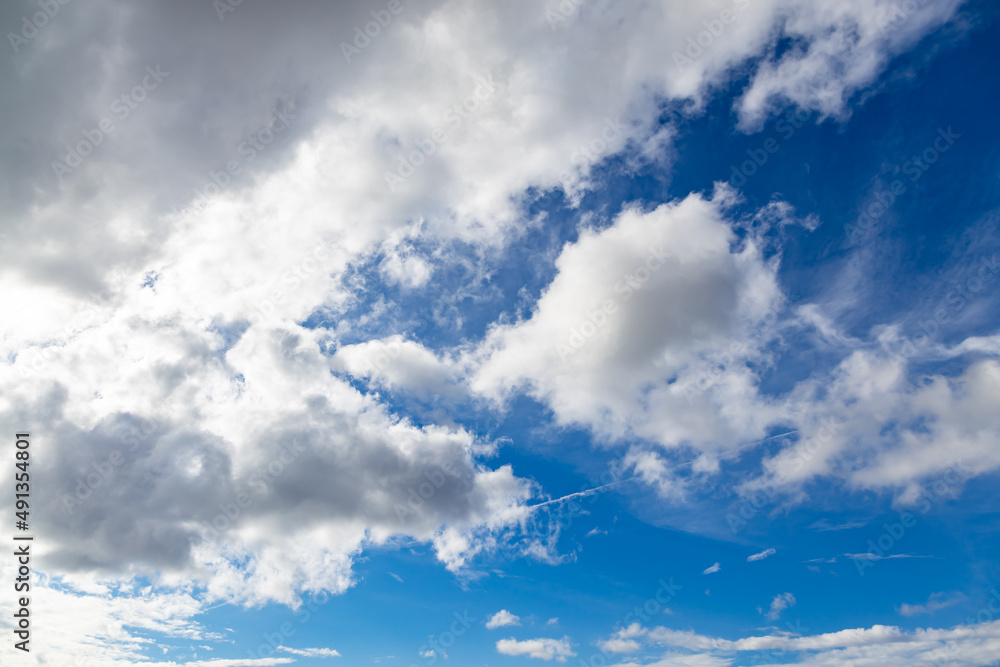Sunrise on a sunny morning. Veil clouds cover the rising sun. white veil clouds on a blue sky. Climate neutral. Sunrise on a sunny morning. Veil clouds cover the rising sun. white veil clouds on a blue sky. Climate neutral.