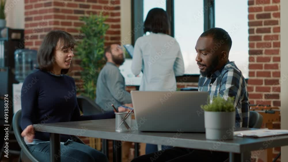 African american man greeting female applicant at hiring meeting, talking about corporate career opportunity. Confident woman attending employment job interview with male recruiter. African american man greeting female applicant at hiring meeting, talking about corporate career opportunity. Confident woman attending employment job interview with male recruiter.
