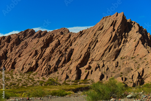 Jagged geological landforms on the way from Fiambalá to the Paso San Francisco mountain pass, Catamarca province, Argentina photo