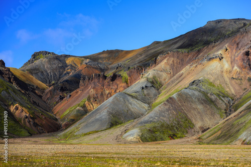 Colorful rhyolite hills surrounding a green valley, Landmannalaugar, Fjallabak Nature Reserve, Central Highlands, Iceland