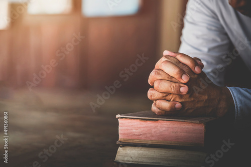 Fotobehang Hands of a man pray on bible, hope, faith, christianity, religion concept