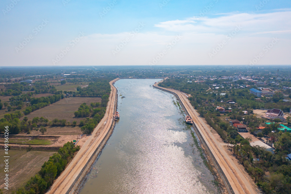 Aerial top view of Bueng Sa Bua Pond. River lake with forest trees, green mountain hills, or lake. Nature landscape background, Thailand. Aerial top view of Bueng Sa Bua Pond. River lake with forest trees, green mountain hills, or lake. Nature landscape background, Thailand.
