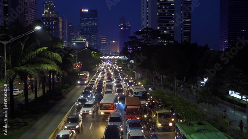 Beautiful busy traffic with highrise buildings at night photo