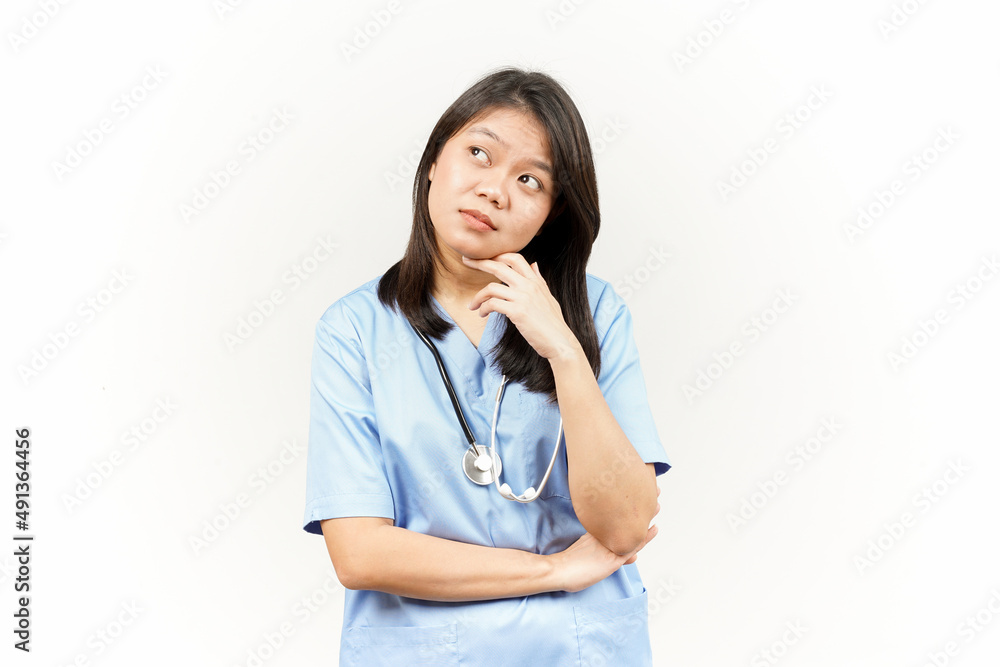 Thinking and Curious Of Asian Young Doctor Isolated On White Background Thinking and Curious Of Asian Young Doctor Isolated On White Background
