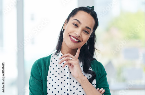 What differentiates you from the rest makes you a success. Portrait of a confident young businesswoman working in a modern office. © Nicholas F/peopleimages.com