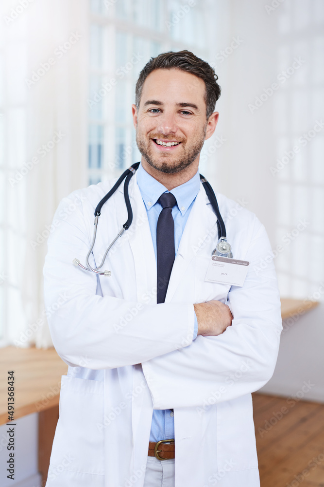 Lets get you better asap. Portrait of a confident young doctor standing in his consulting room. Lets get you better asap. Portrait of a confident young doctor standing in his consulting room.