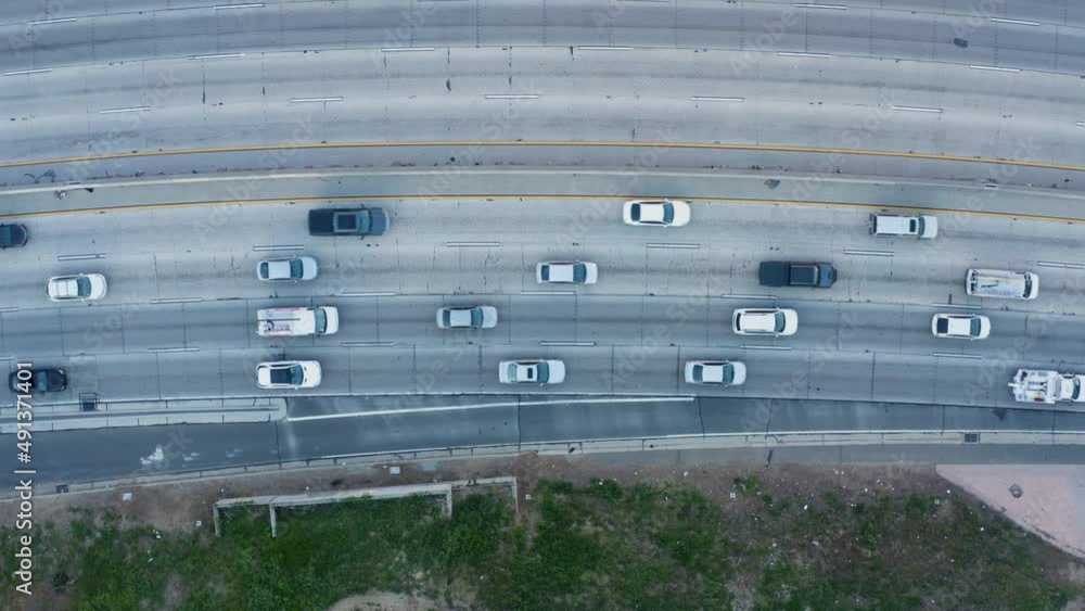 Direct view from above to the road traffic in a big city. Top down aerial of cars drive. Traffic. Top view of the city wide road. Direct view from above to the road traffic in a big city. Top down aerial of cars drive. Traffic. Top view of the city wide road.