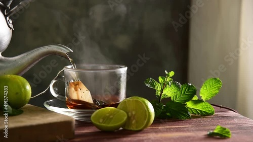 hot water pouring into tea cup
