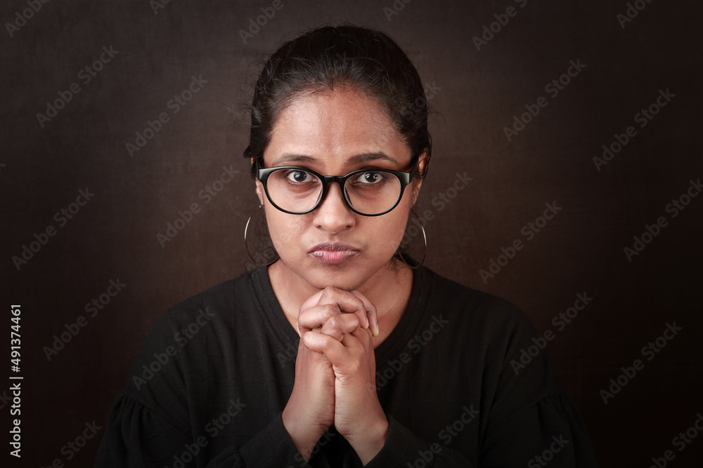 Portrait of an Indian ethnic woman with a worried face Portrait of an Indian ethnic woman with a worried face