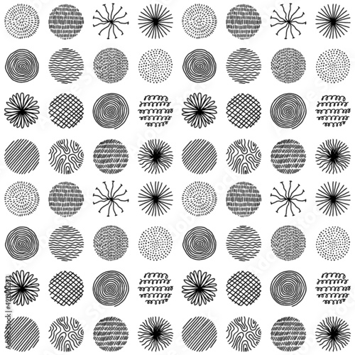 Hand drawn circles with doodle texture. Modern abstract seamless pattern with black organic round shapes with lines, circles, drops. Vector illustration on white background.
