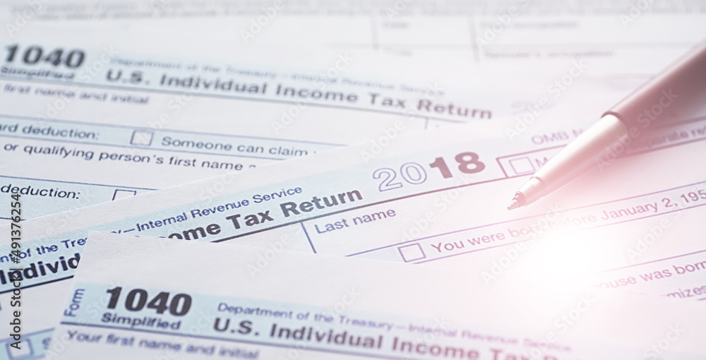 Annual tax reporting. Tax form on the table. Financial statements for signature. Annual tax reporting. Tax form on the table. Financial statements for signature.