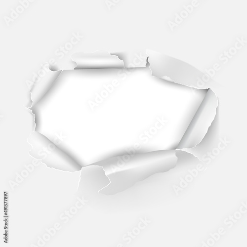 Torn hole in the sheet of paper. Paper frame.