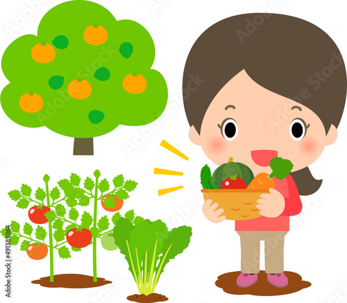野菜の畑と野菜を持った笑顔の女性