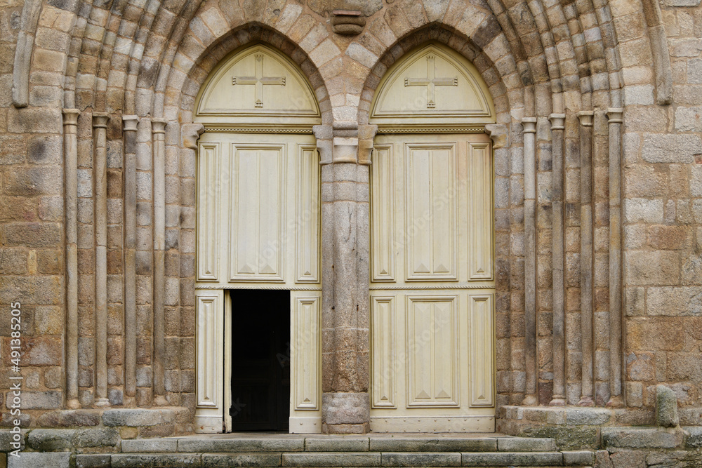 Symmetrical Ivory catholic doors of a church