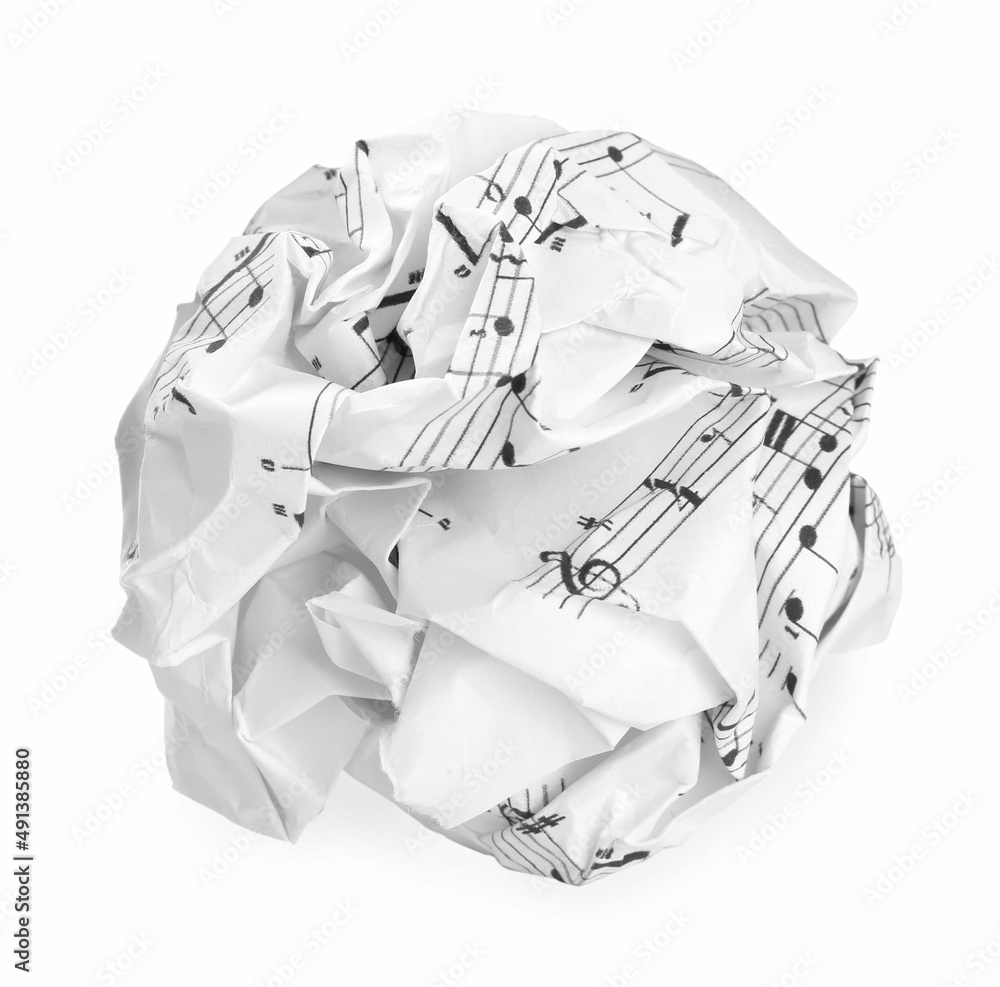 Crumpled sheet of paper with musical notes isolated on white Crumpled sheet of paper with musical notes isolated on white