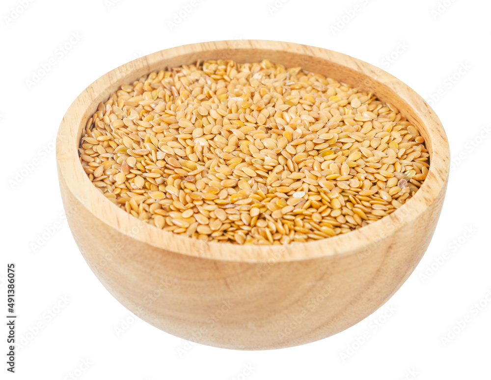 The Gold Flax seed in wooden bowl isolated on white background. The Gold Flax seed in wooden bowl isolated on white background.