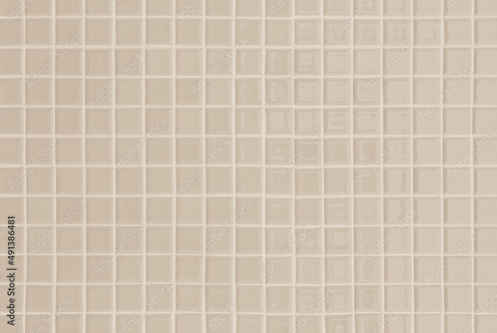Pastel cream ceramic wall and floor tiles mosaic abstract background. Design geometric wallpaper texture decoration.
