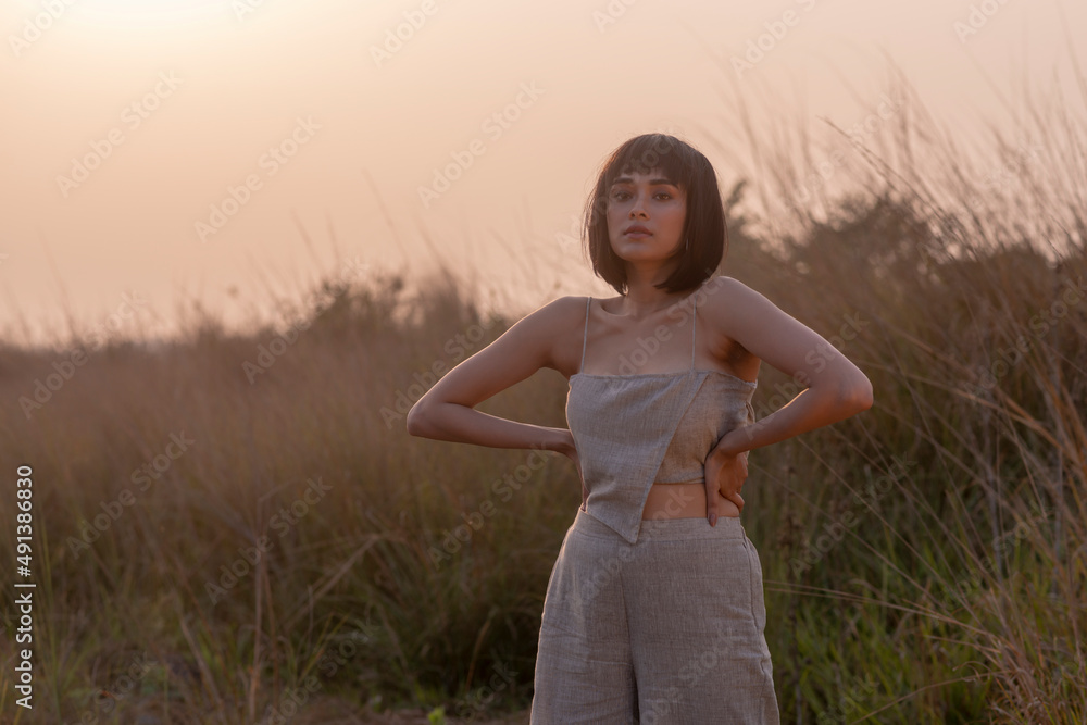 Beautiful Young Fashion model posing outdoor in casual garments Beautiful Young Fashion model posing outdoor in casual garments