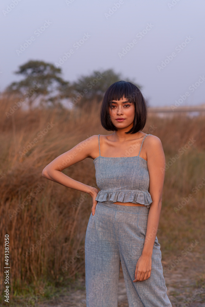 Beautiful Young Fashion model posing outdoor in casual garments Beautiful Young Fashion model posing outdoor in casual garments