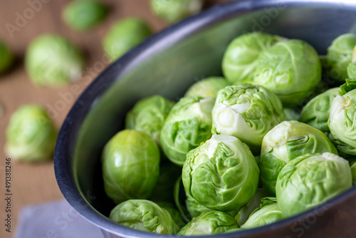 Brussels sprouts in metal bowl on napkin