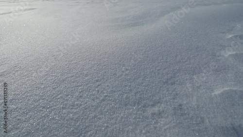 movement of snow particles on a white snow fancy cover, footprints in snow
