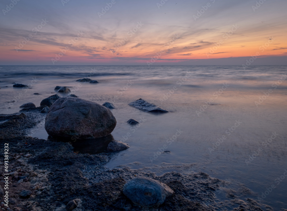 rocks in the sea at sunset