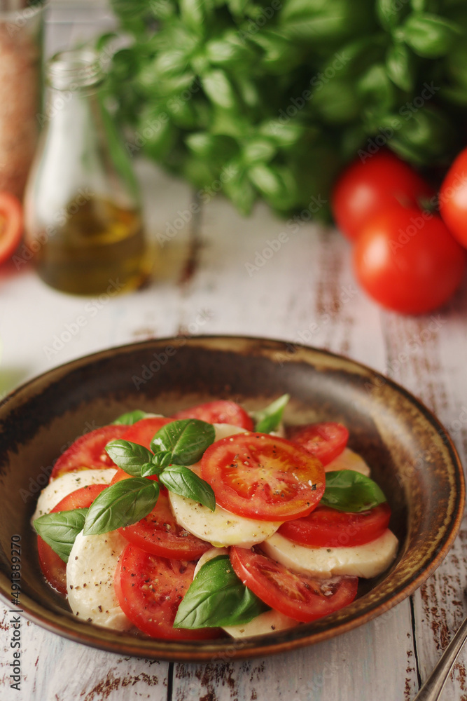 A bowl with traditional Italian caprese salad A bowl with traditional Italian caprese salad