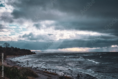 dark clouds on a windy beach shore coast