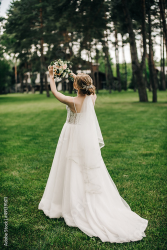 Bride in a wedding dress from the back 
