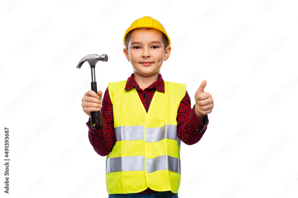 building, construction and profession concept - little boy in protective helmet and safety vest with hammer showing thumbs up over white background building, construction and profession concept - little boy in protective helmet and safety vest with hammer showing thumbs up over white background