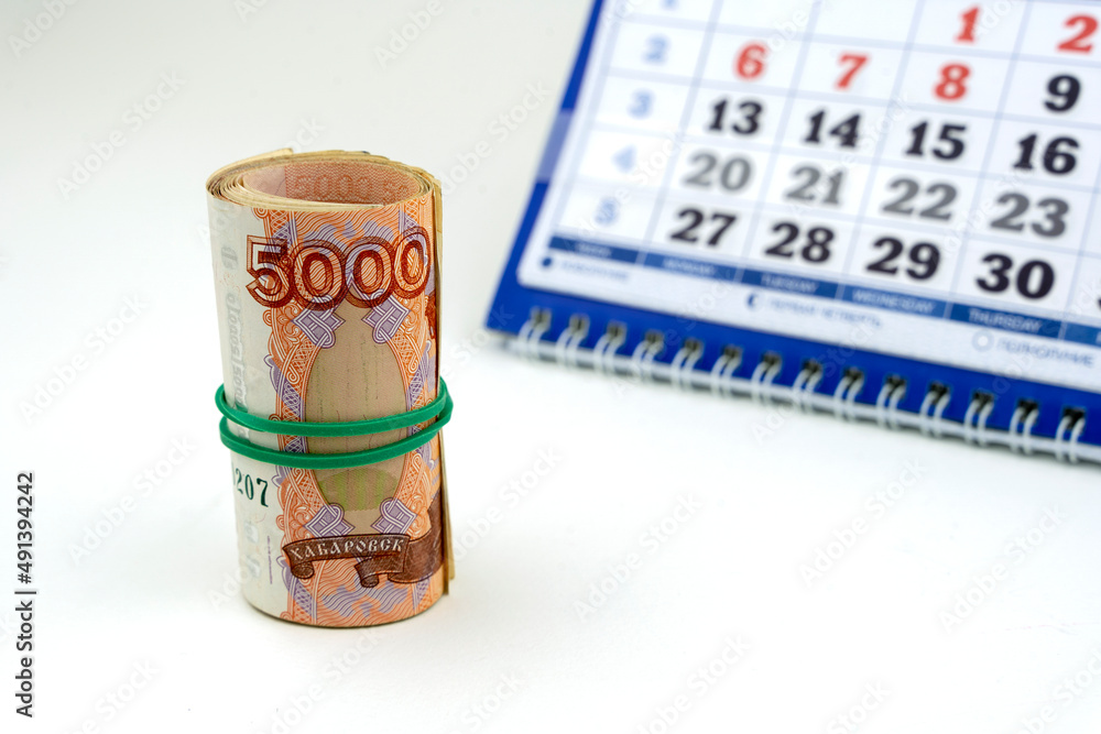 Russian money on the background of the calendar Russian money on the background of the calendar