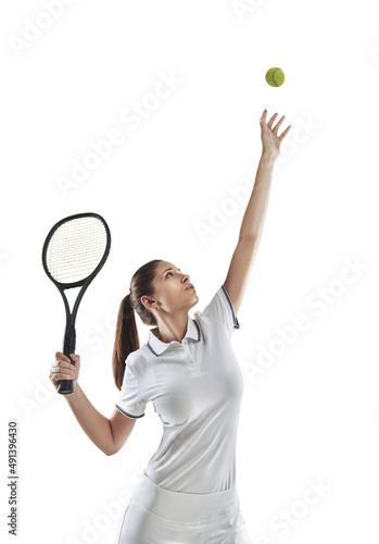 Keep calm and serve an ace. Studio shot of a female tennis player getting ready to serve the ball.