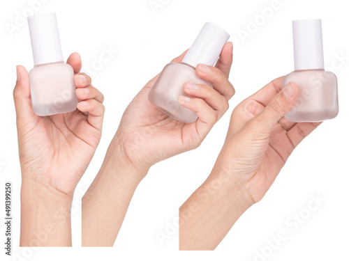 Collection of Hand holding Foundation cosmetic bottle isolated on white background.