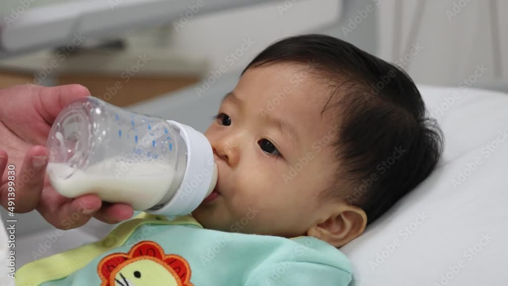 Asian Chinese 11month old baby boy drinking milk Asian Chinese 11month old baby boy drinking milk