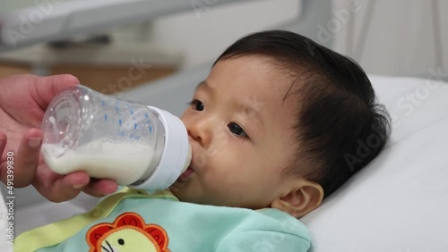 Asian Chinese 11month old baby boy drinking milk photo