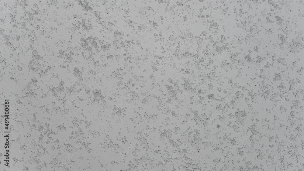 Obraz premium Banner with wet and snowy with water drops and ice glass window at rainy, stormy and snowy day. Concept of seasonal mood, background with copy space.