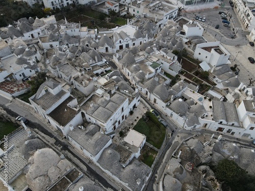 Aerial view of Alberobello, city of Trulli in Itria Valley, Puglia. Traditional Apulian dry stone huts with a conical roof in the Murge area of the Italian region of Apulia. Trulli city in south Italy