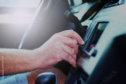 Close up of man using car stereo