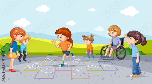 Happy children playing hopscotch on playground photo
