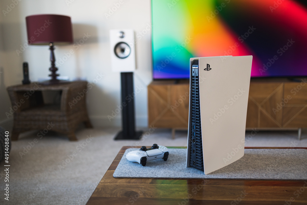 LONDON - MARCH 7, 2022: PlayStation 5 video games console and PS5  controller by living room tv Stock Photo | Adobe Stock