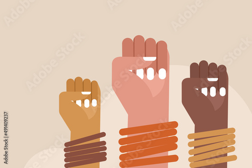 Closed fists of women wearing bangles. Concept for Women's day