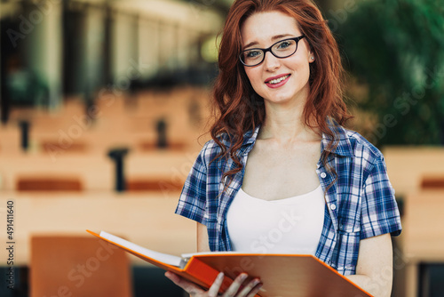 Education library high school university learning people concept. Smiling student girl reading book