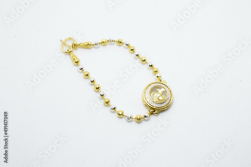 Lucky Golden Windmills Bracelet which brings business good luck display on isolated white background.