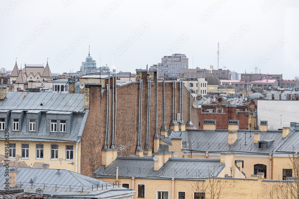 Grey roofs of the old city in the European capital on a cloudy day