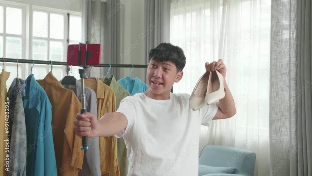 Asian Man Online Seller Recommending Kitten Heels And Recording Video By Mobile Phone While Selling Shoes At Home
Asian Man Online Seller Recommending Kitten Heels And Recording Video By Mobile Phone While Selling Shoes At Home
