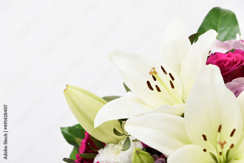 Obraz premium Composition with beautiful blooming lily flowers on white background , macro 