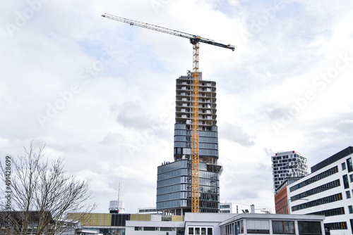 Crane and building under construction , modern 