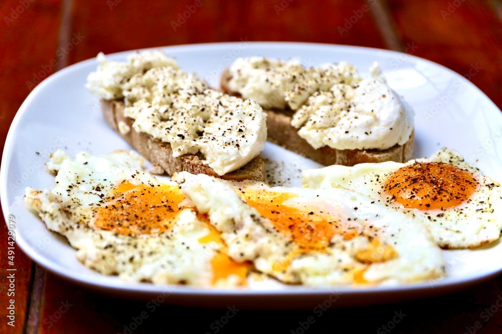 breakfast with egg and bread with some cream cheese breakfast with egg and bread with some cream cheese